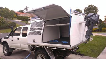 Canopy 2 with separate dog compartment and outboard motor bracket            